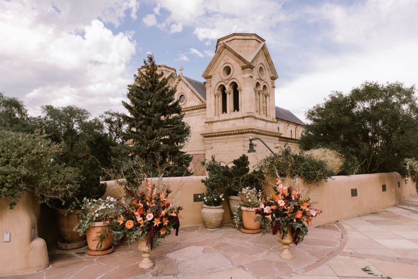 New Mexico wedding Santa Fe planning La Fonda gown suit inspiration design floral bouquet lace photography romantic styled local perfect wedding guide venue architecture historical building cathedral outdoor